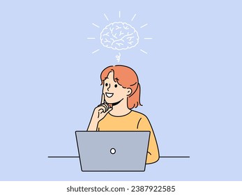 Smiling girl is doing brainstorming sitting near laptop and thinking about best solution to problem. Schoolgirl doing brainstorming about getting online education on school website