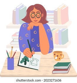 A smiling girl with glasses draws with a pencil in a notebook. Textbooks, a glass with pencils, a mug of tea are on the table. Shelves with books in the background. Vector illustration in flat style.