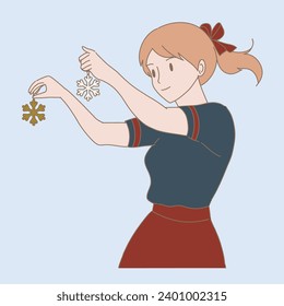 Smiling girl holding golden and silver snowflake shaped Christmas decorations in hands. Joyful woman preparing, decorating for winter season.  Hand drawn flat cartoon character vector illustration.