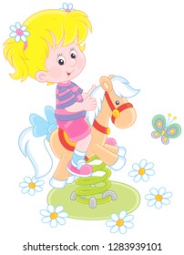Smiling girl on a toy horse swing on a playground, vector illustration in a cartoon style