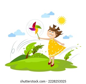 smiling girl is playing with a colorful pinwheel outdoor