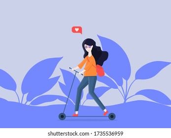 Smiling girl riding a scooter in the park