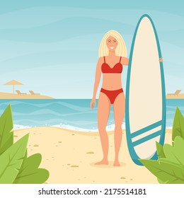 Smiling girl with a surfboard on the beach. 