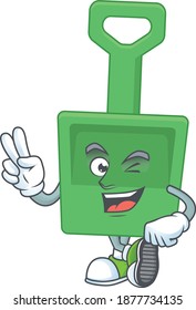 smiling green sand bucket cartoon mascot style with two fingers. Vector illustration