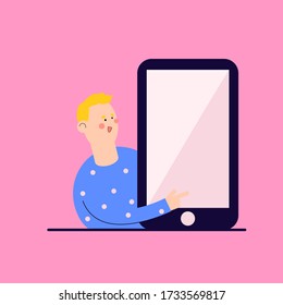 Smiling guy with a phone. Shows the phone screen, points to it with a finger.