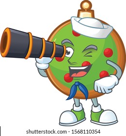 Smiling happy christmas ball as a sailor with binocular.
