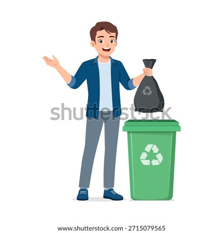 Smiling happy man standing with a green recycling bin holding a black trash bag ready to dispose of waste