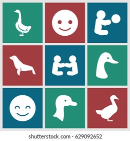 Smiling icons set. set of 9 smiling filled icons such as goose, seal, smiling emot, baby playing with toy