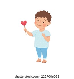 Smiling Little Boy Giving Heart Candy on Stick Sharing with Somebody Vector Illustration