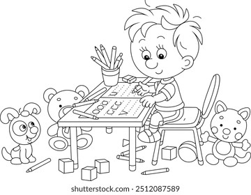 Smiling little boy writing in a copybook at his desk among funny toys in a nursery room, black and white outlined vector cartoon illustration for a coloring book page