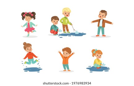 Smiling Little Children Splashing in Puddle Walking in Wet Rainy Day Vector Set