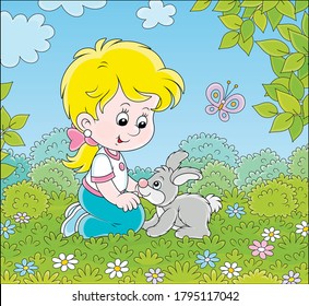 Smiling little girl playing with her small grey bunny among flowers on green grass on a summer day, vector cartoon illustration