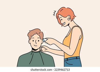 Smiling male client get hairdo in barbershop. Female barber give hairstyle to happy man customer in saloon. Beauty and haircare. Vector illustration. 