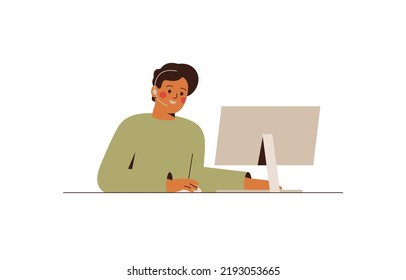 Smiling male employee is working at the computer in the call center or support department. Young man with a headset talks with friends or colleagues via internet. Online communication, hotline concept