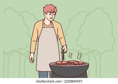 Smiling man in apron making meat on grill in park. Happy guy have fun cooking barbecue outdoors. Weekend and relaxation. Vector illustration. 