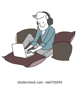Smiling man dresses in casual style with headset enjoying his time typing keyboard and using laptop for connecting with his social network or gaming. He sitting cozy surrounded with pillows.