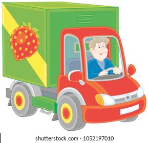 Smiling man driving his truck with vegetables and fruit