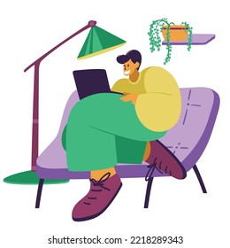 a smiling man sits with a laptop on a sofa with his legs crossed. The concept of work from home, remote work, work in isolation