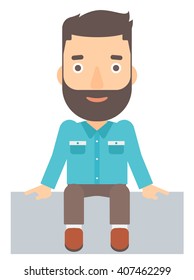 Smiling man sitting.