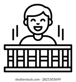 A smiling man stands behind a railing fence looking happy and relaxed outdoors