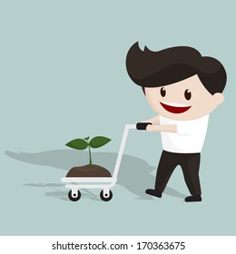 Smiling man using trolley to transport seedling