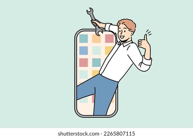 Smiling man with wrench in hands repair smartphone. Happy mechanic or technician fix cellphone application. Technology concept. Vector illustration. 