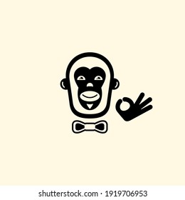 Der lächelnde Affe zeigt mit seinen Fingern eine Geste, dass alles in Ordnung ist. Vektorgrafik.Logo.Flaches Design..