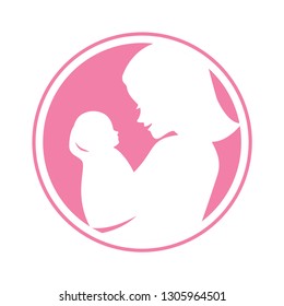 Smiling mother holding her baby