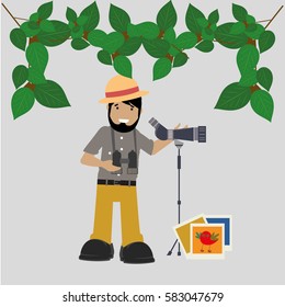 Smiling nature observer with his camera and binoculars and hat
