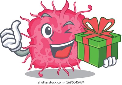 Smiling pathogenic bacteria cartoon character having a green gift box