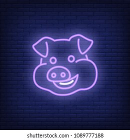 Smiling pig cartoon character. Neon sign element. Night bright advertisement. Vector illustration for new year, twenty nineteen, restaurant menu