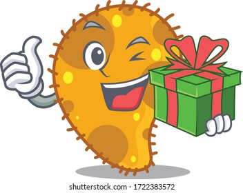 Smiling pseudomonas cartoon character having a green gift box