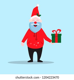 Smiling Santa Claus in a red hat holding Christmas gift in hand. Christmas concept.