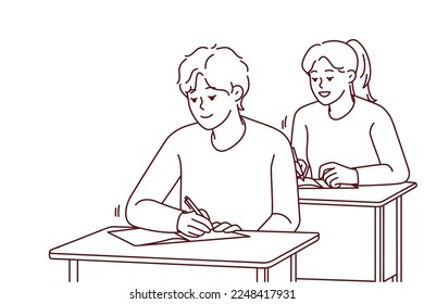 Smiling students sit at desk writing in notebooks on lesson in school. Happy pupils handwriting at class. Education and learning. Vector illustration. 