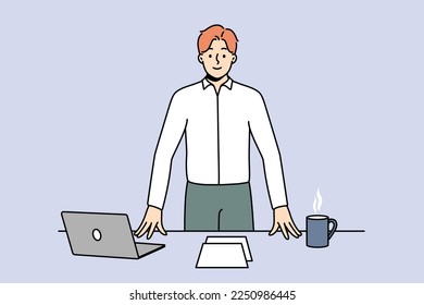 Smiling successful young businessman near office desk with laptop. Happy confident male CEO or boss with computer and coffee on table at workplace. Vector illustration. 