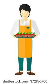 Smiling supermarket worker.