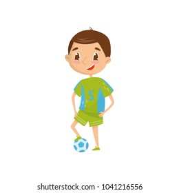 Smiling teen boy wants to be professional football player in future. Career day in school. Dream profession. Cartoon child in green sports wear. Flat vector design