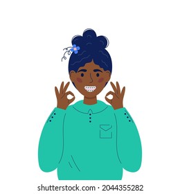 Smiling teen with braces. Dental braces concept. Dental care. Smiling trendy afro american girl with braces in flat style.Orthodontic treatment. Girl showing okey.White background.