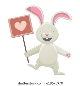 Smiling white bunny holding poster with rosy heart isolated on white. Easter symbol with pink long ears, open mouth and two teeth