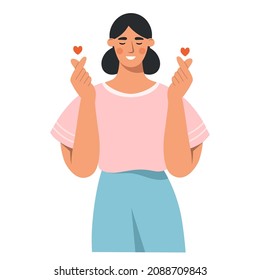 Una mujer sonriente cruza dos dedos en forma de corazón, una señal expresa amor. Gesto del corazón coreano. El concepto de amor y felicidad. Idioma del cuerpo. Ilustración vectorial plana sobre fondo blanco.