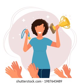 A smiling woman with a cup and a medal in her hands. Applause for the winner. Vector illustration in flat style.