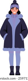 A smiling woman in a dark blue winter coat and matching hat stands with her hands in pockets, exuding warmth and comfort in a minimalist style.