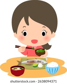 A smiling woman eating Japanese food such as grilled fish