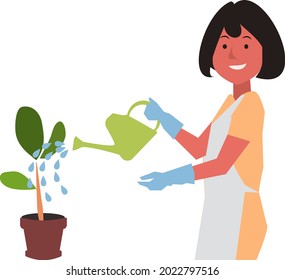  smiling woman with gloves on watering plants