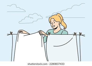 Smiling woman hanging fresh clothes on wire to dry outdoors. Happy housewife drying clothing on washing line. Household and chores. Vector illustration. 