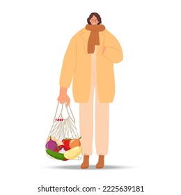 Smiling woman holding Zero waste string bag. Girl wearing warm comfortable fashionable casual clothes goes with groceries after supermarket. Colored flat cartoon vector illustration isolated on white