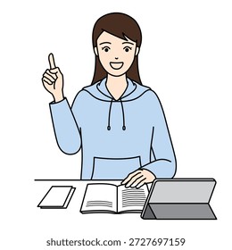 Mujer sonriente que señala el dedo hacia arriba mientras que estudia en el escritorio