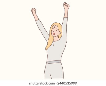 Smiling woman raising hands celebrating success or promotion. Happy woman feeling elated with victory