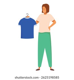 Smiling woman showing a blue t shirt on a hanger, shopping and fashion concept