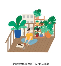 Smiling woman sitting on balcony and replanting plant in pot